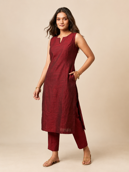 Sleeveless kurti with pants.