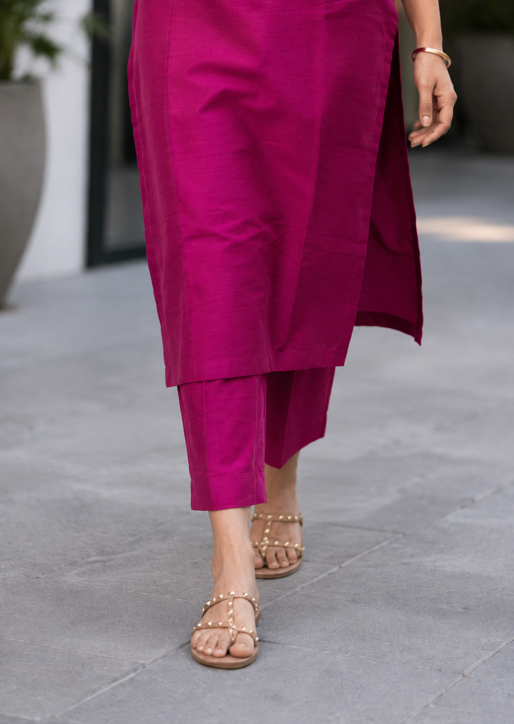 Sleeveless kurti with pants.